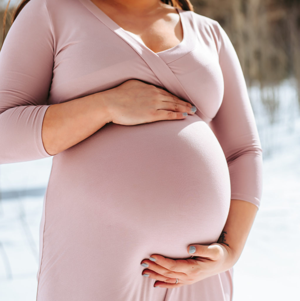 Baby bump at snowy mountain maternity session in colorado 