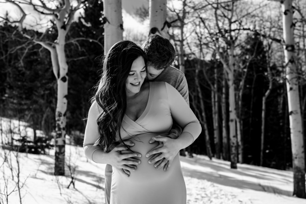 Parents to be loving the baby bump at their colorado maternity session 