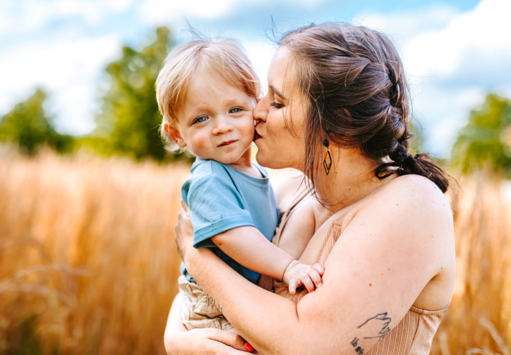 North Carolina Maternity Photographer, Stormy North Carolina Session, Maternity Photos, Maternity Photo ideas, Summer Maternity Photos, Maternity Photographer, Lifestyle Photographer, Family Maternity Photographer, North Carolina Photographer, Tall grass, Family of 3 Maternity Photos, North Carolina, 