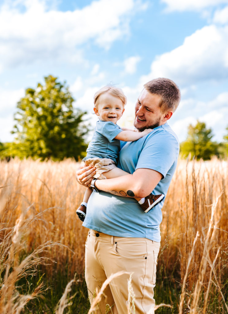 North Carolina Maternity Photographer, Stormy North Carolina Session, Maternity Photos, Maternity Photo ideas, Summer Maternity Photos, Maternity Photographer, Lifestyle Photographer, Family Maternity Photographer, North Carolina Photographer, Tall grass, Family of 3 Maternity Photos, North Carolina,