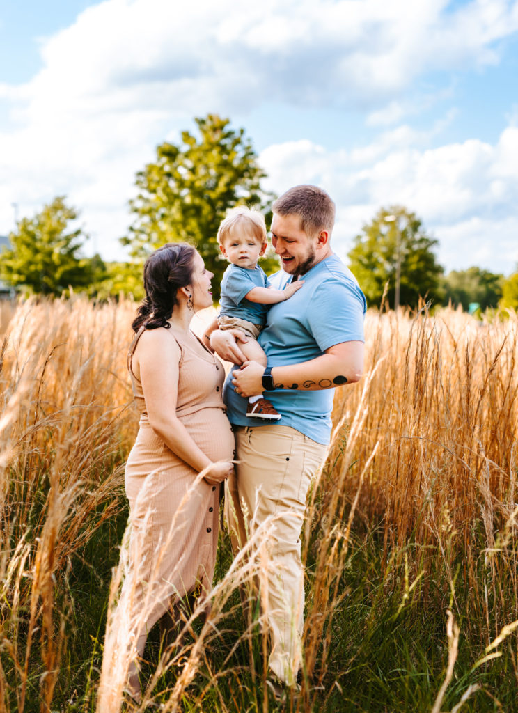 North Carolina Maternity Photographer, Stormy North Carolina Session, Maternity Photos, Maternity Photo ideas, Summer Maternity Photos, Maternity Photographer, Lifestyle Photographer, Family Maternity Photographer, North Carolina Photographer, Tall grass, Family of 3 Maternity Photos, North Carolina,