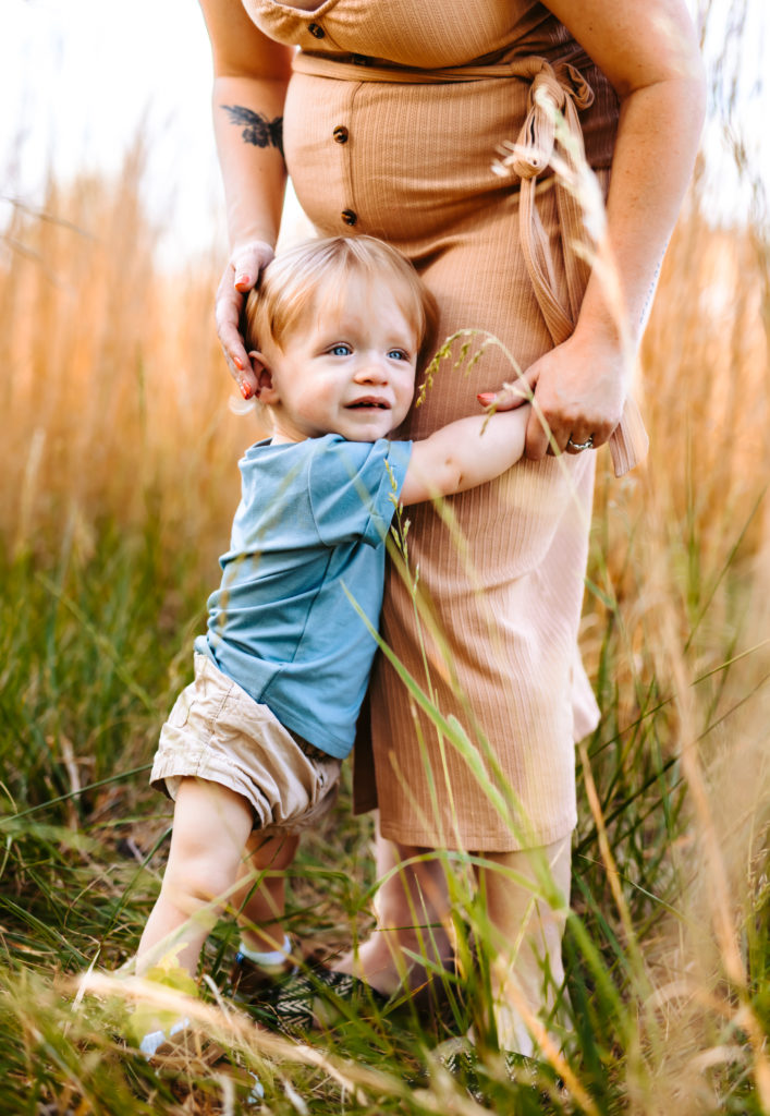 North Carolina Maternity Photographer, Stormy North Carolina Session, Maternity Photos, Maternity Photo ideas, Summer Maternity Photos, Maternity Photographer, Lifestyle Photographer, Family Maternity Photographer, North Carolina Photographer, Tall grass, Family of 3 Maternity Photos, North Carolina,