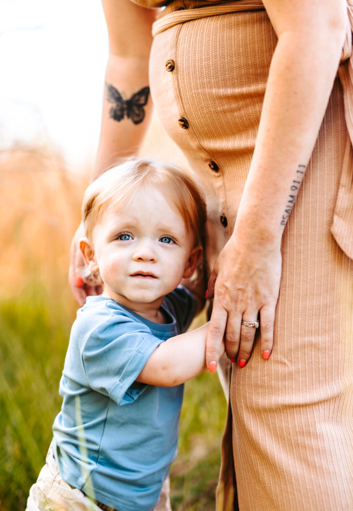 North Carolina Maternity Photographer, Stormy North Carolina Session, Maternity Photos, Maternity Photo ideas, Summer Maternity Photos, Maternity Photographer, Lifestyle Photographer, Family Maternity Photographer, North Carolina Photographer, Tall grass, Family of 3 Maternity Photos, North Carolina,