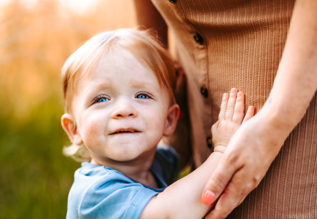 North Carolina Maternity Photographer, Stormy North Carolina Session, Maternity Photos, Maternity Photo ideas, Summer Maternity Photos, Maternity Photographer, Lifestyle Photographer, Family Maternity Photographer, North Carolina Photographer, Tall grass, Family of 3 Maternity Photos, North Carolina,