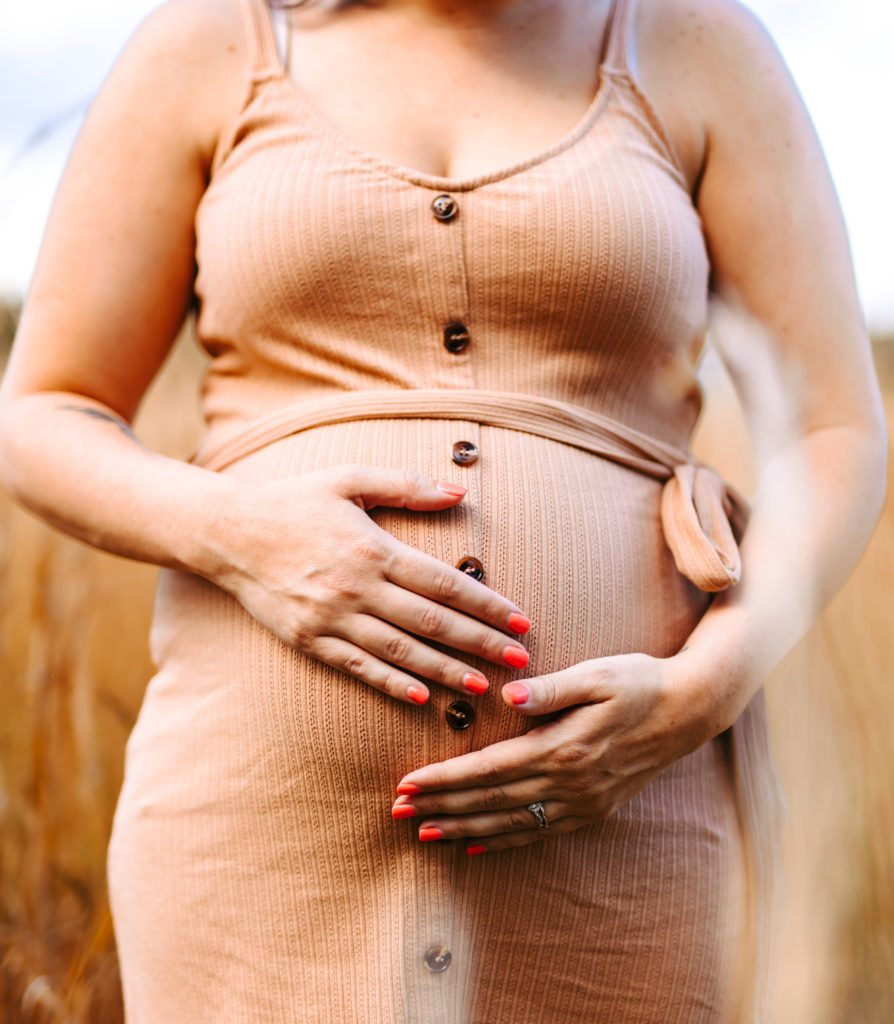 North Carolina Maternity Photographer, Stormy North Carolina Session, Maternity Photos, Maternity Photo ideas, Summer Maternity Photos, Maternity Photographer, Lifestyle Photographer, Family Maternity Photographer, North Carolina Photographer, Tall grass, Family of 3 Maternity Photos, North Carolina,