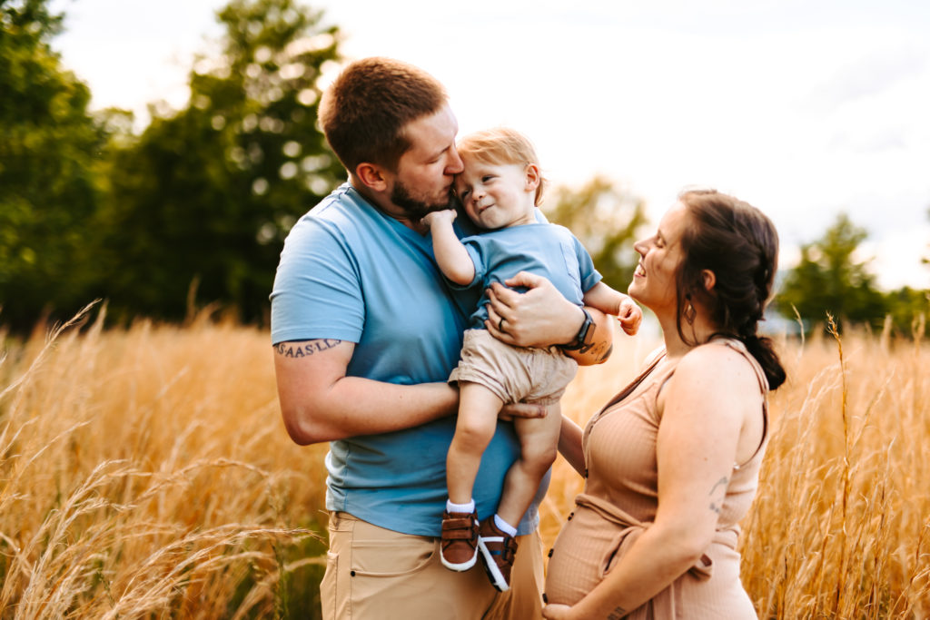 North Carolina Maternity Photographer, Stormy North Carolina Session, Maternity Photos, Maternity Photo ideas, Summer Maternity Photos, Maternity Photographer, Lifestyle Photographer, Family Maternity Photographer, North Carolina Photographer, Tall grass, Family of 3 Maternity Photos, North Carolina,