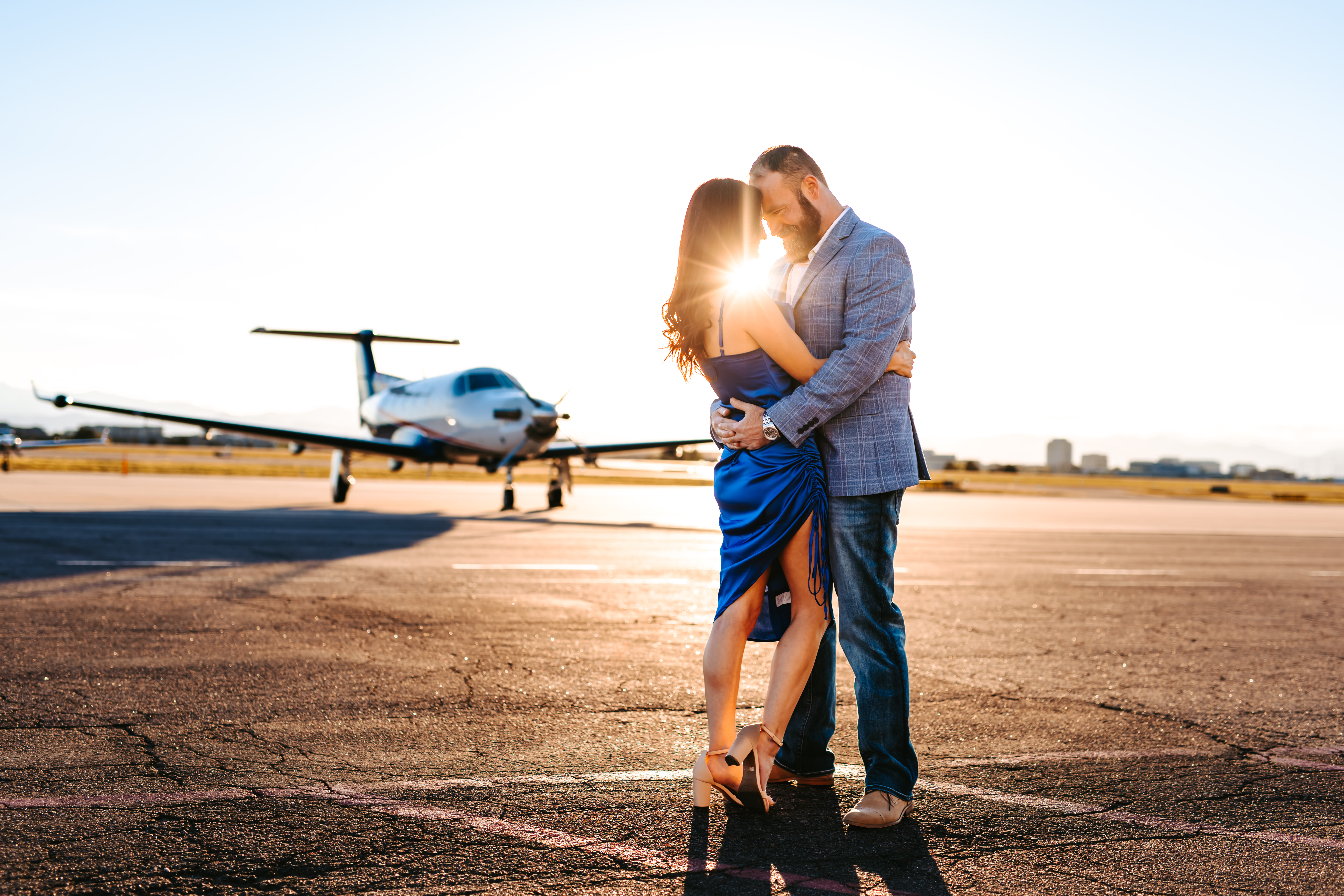 Couple at an airport for a Surprise Proposal
