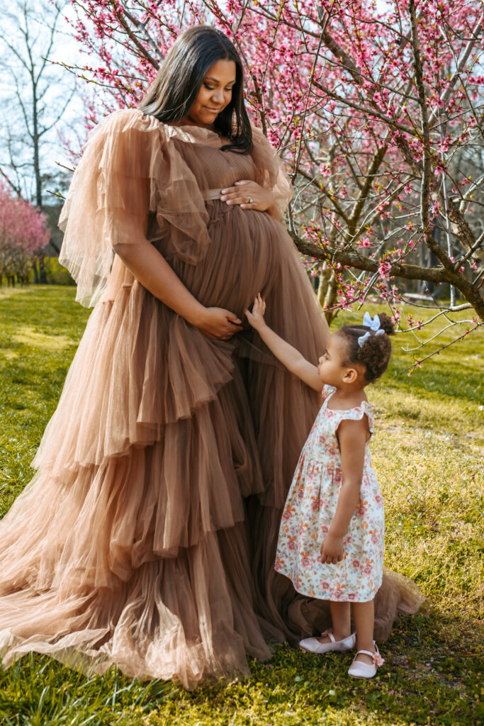 Soon to be Mother of two Maternity portrait amid the Peach blooms at Millstone Creek Orchard - By RattTrap Artistry 