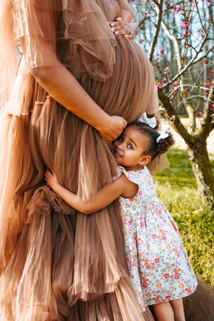 Soon to be Mother of two Maternity portrait amid the Peach blooms at Millstone Creek Orchard - By RattTrap Artistry 