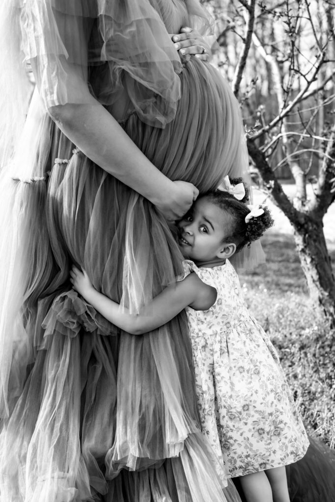 Soon to be Mother of two Maternity portrait amid the Peach blooms at Millstone Creek Orchard - By RattTrap Artistry 