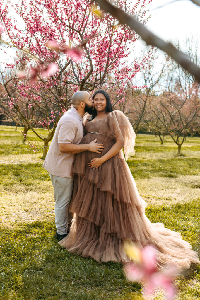 Couples Maternity Portraits amid the Peach blooms at Millstone Creek Orchard - Photo By RattTrap Artistry 