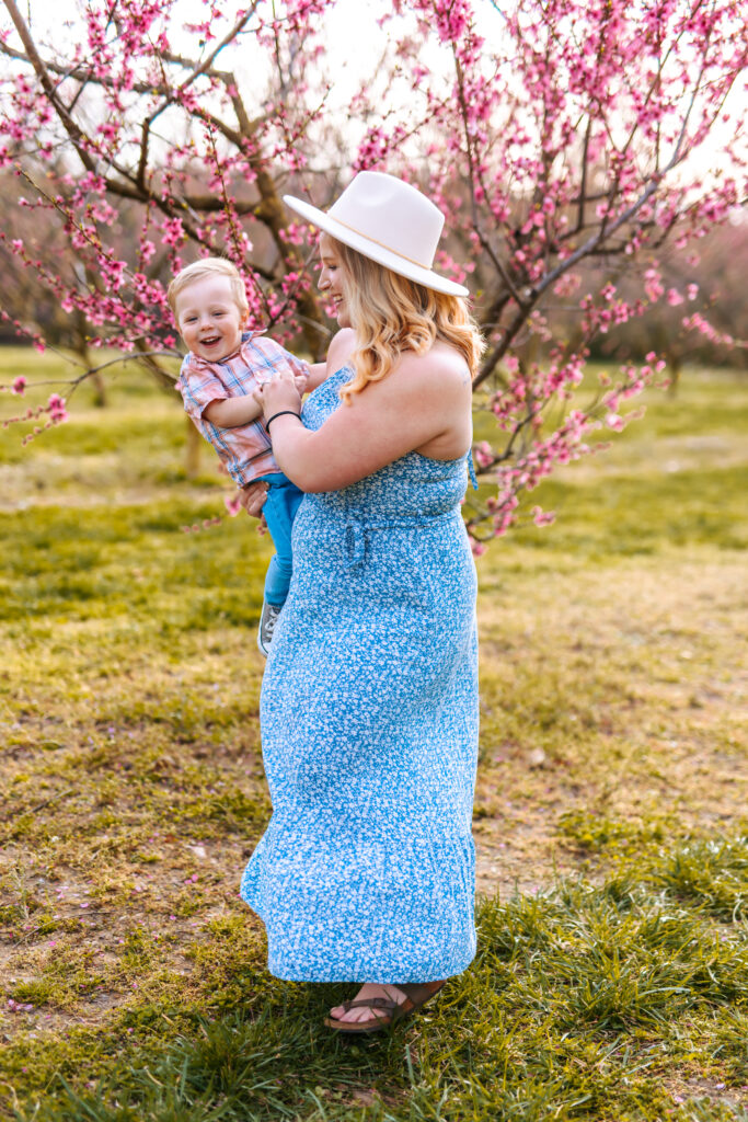 Motherhood Mini's, North Carolina Photographer, Motherhood Sessions, Springs Mini's, Peach Bloom Mini's, Millstone Creek Orchard, North Carolina Family Photographer, Motherhood, Spring Photo ideas, Motherhood sessions, mothers day photos, mothers day photo ideas, spring time, Motherhood Inspiration, Mommy & me Photo ideas, Motherhood photo ideas, Peach Blossoms, 