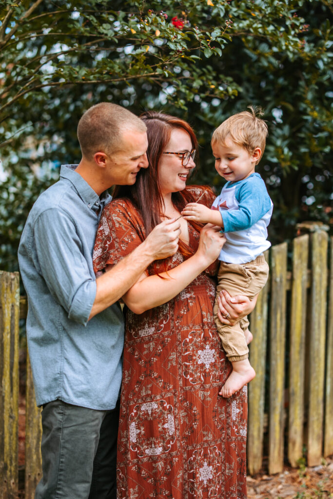 Photo of a family of there, at home family photos session in High Points, North Carolina 