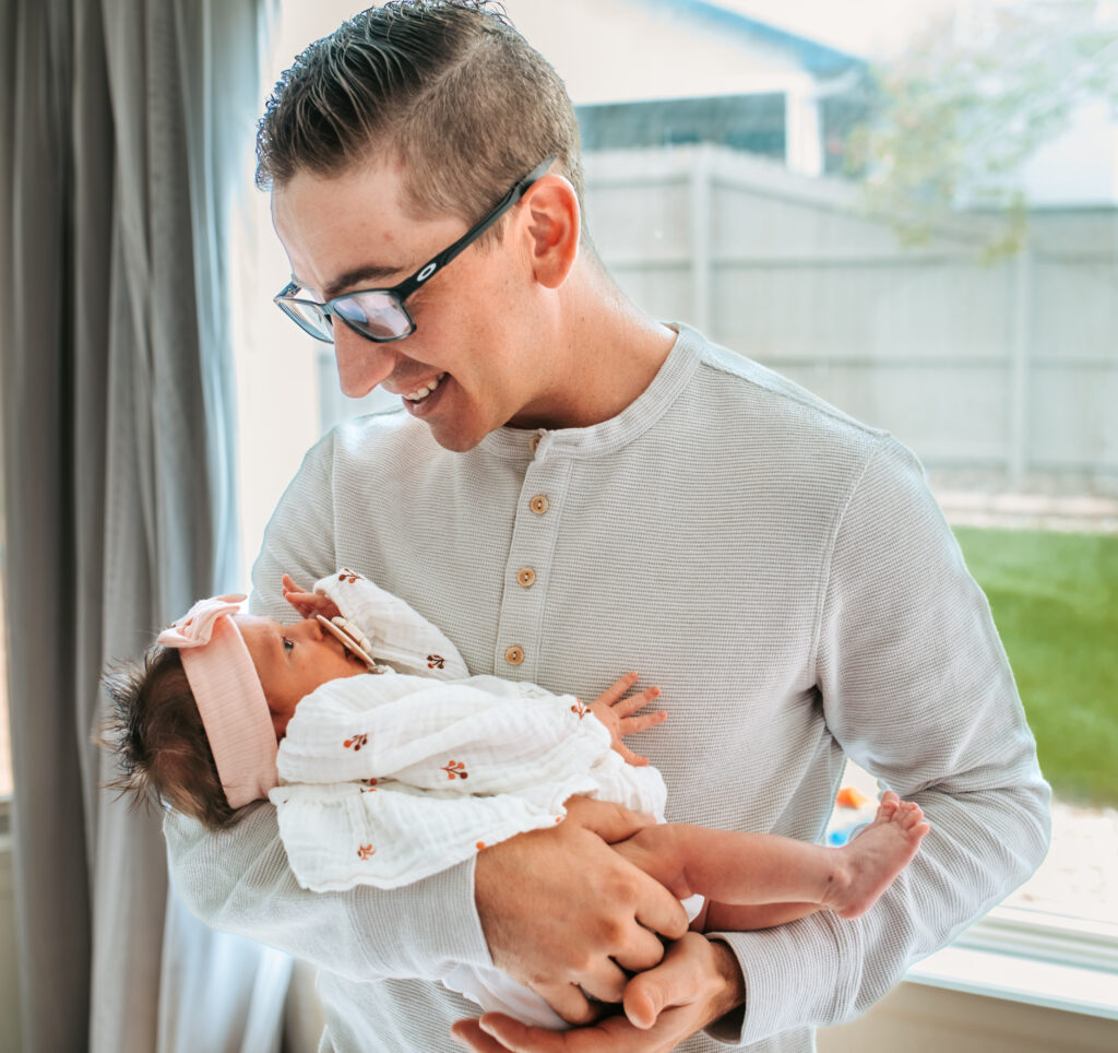 Dad and his baby girl for their in home newborn session 