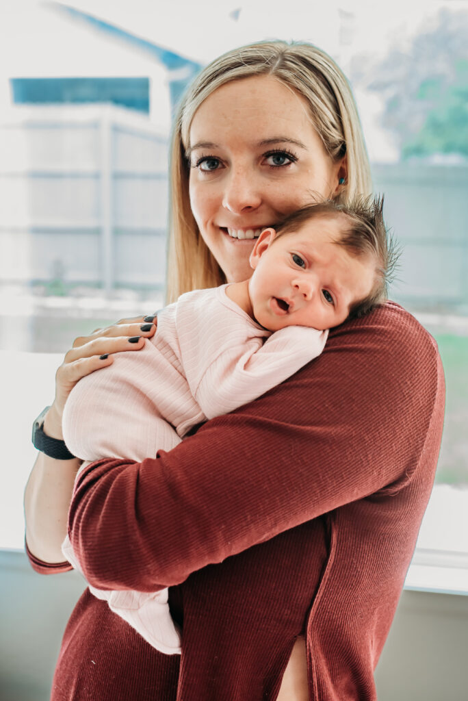 Mom and her baby girl at their in home newborn session 