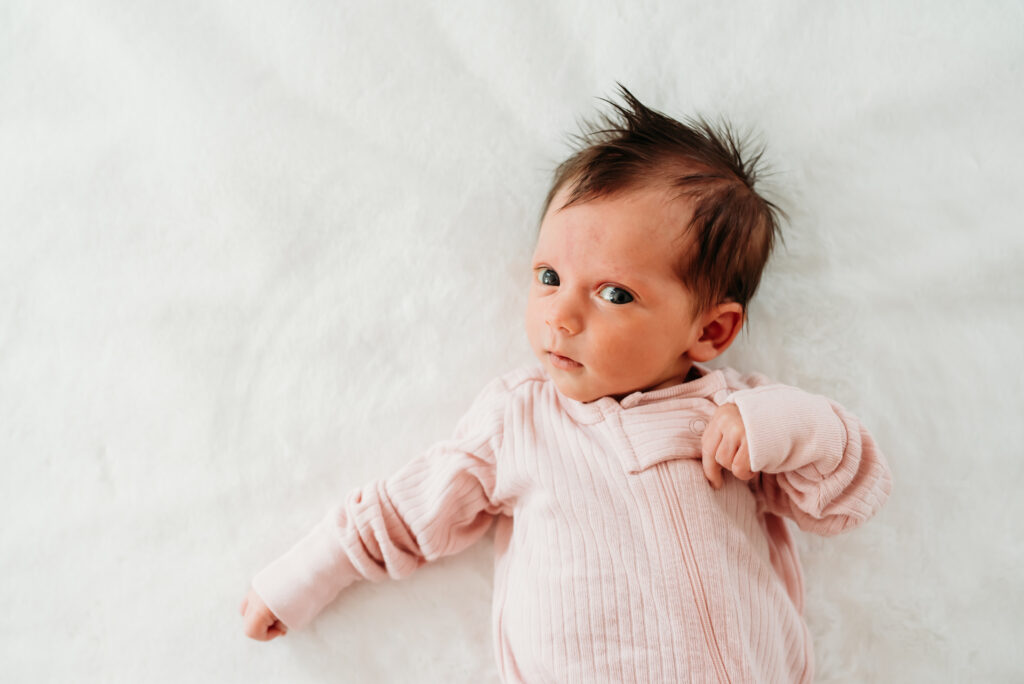 Baby girl at her in home newborn session 