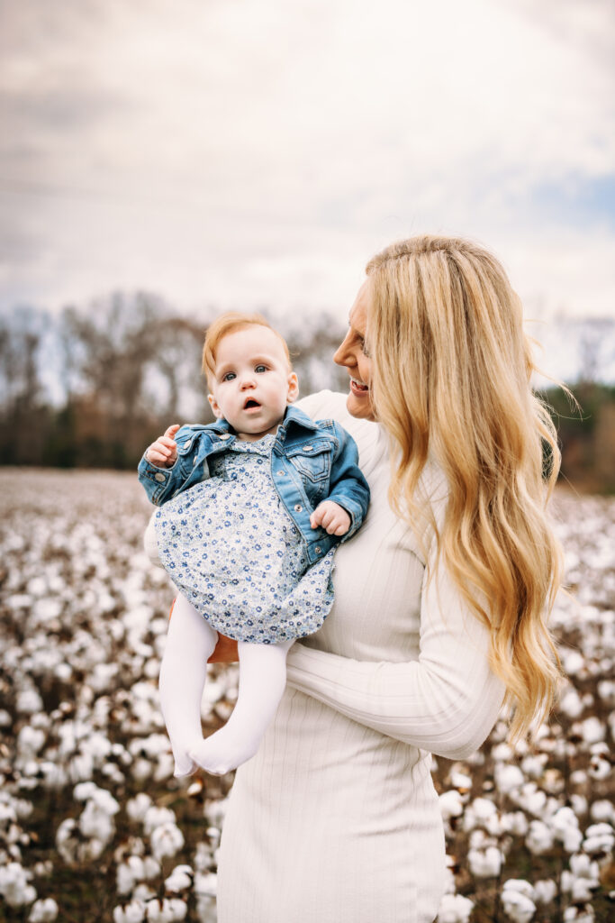 Mother and daughter in a field of cotton at family session in North Carolina 