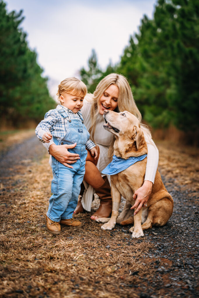 Mother and son loving on their dog at family session in North Carolina 