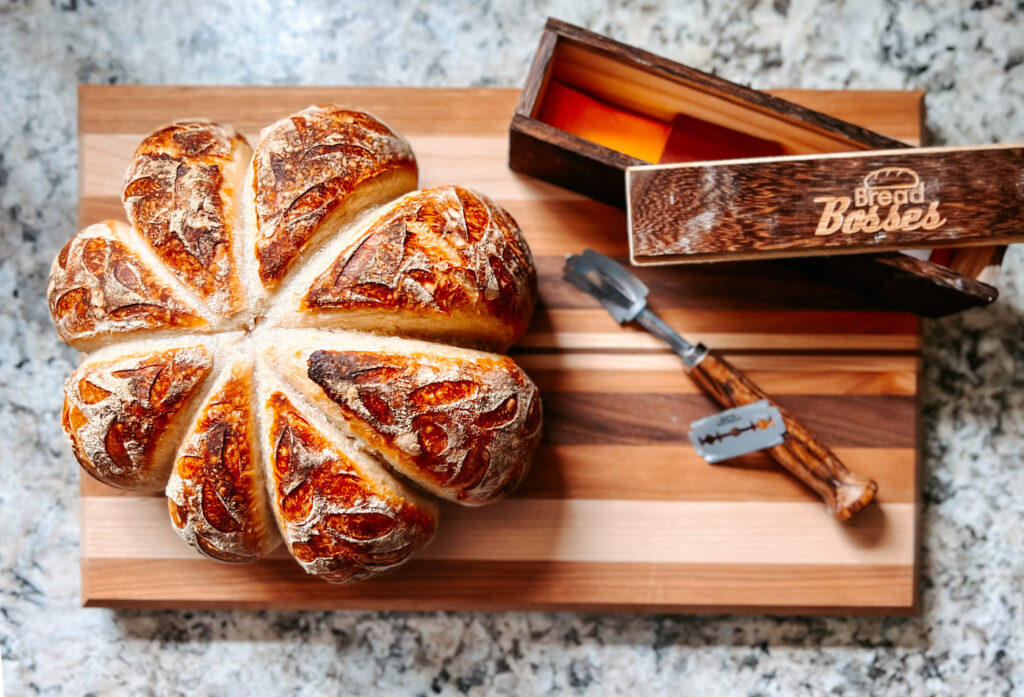 Fresh Sourdough Loaf of bread on a Custom wood cutting board by Ratt's W4 