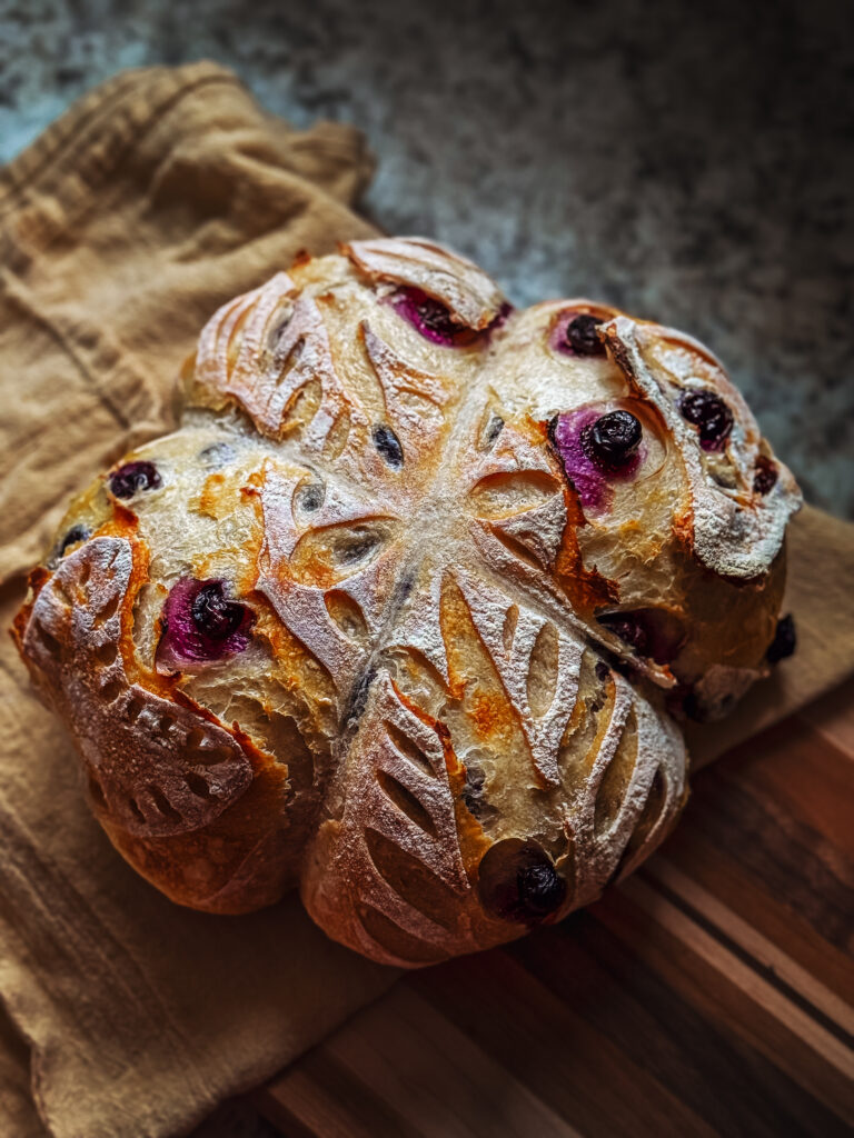 Fresh Lemon and Blueberry Scored Sourdough loaf for valentine's Day. Crated and Captured by RattTrap Artistry 