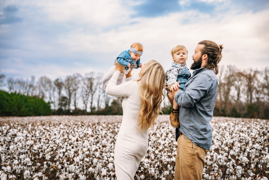 Photo of a family in a Cotton Field in Albemarle North Carolina by RattTrap Artistry North Carolina Family Photographer 